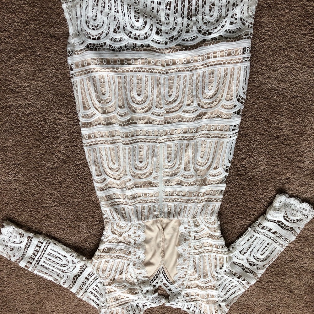 White lace dress. A Line up the knee key hole back